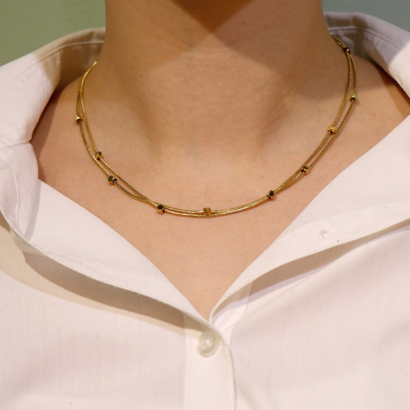 Collier double rangs cubes acier doré