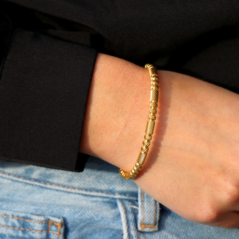 Bracelet jonc fermé strié acier doré