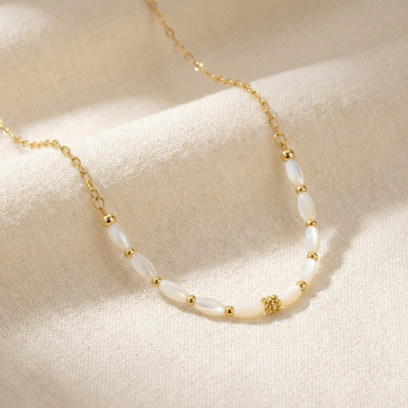 Collier nacre allongée - acier doré