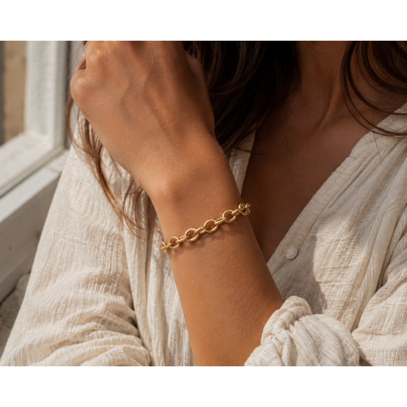 Bracelet maille ovale striée acier doré