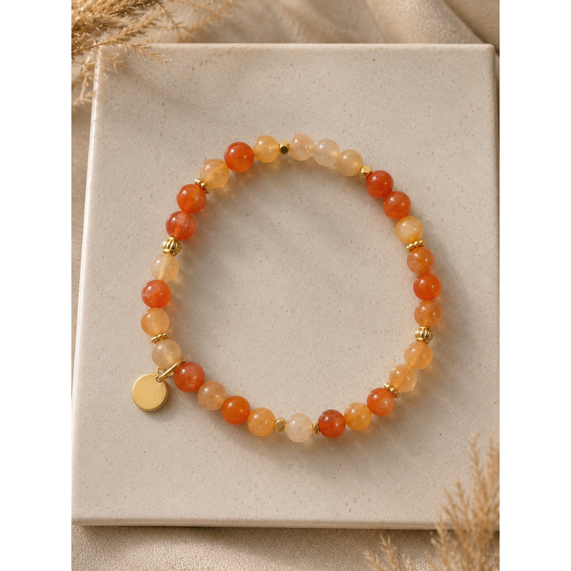 Bracelet élastique cornaline 6mm - acier doré